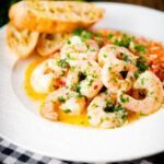 Camarao à guilho (Portuguese garlic prawns) served with arroz con tomate and toasted bread.