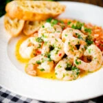 Camarao à guilho (Portuguese garlic prawns) served with arroz con tomate and toasted bread.