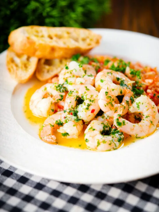 Camarao à guilho (Portuguese garlic prawns) served with arroz con tomate and toasted bread.