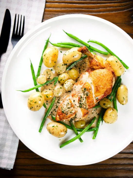 Overhead chicken with Veronique sauce (grapes, vermouth and tarragon), new potatoes and fine beans.