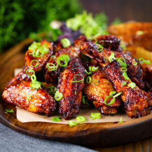 Sticky Chinese chicken wings with a takeaway inspired spare rib glaze served with potato wedges.