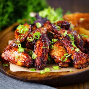 Sticky Chinese chicken wings with a takeaway inspired spare rib glaze served with potato wedges.