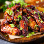 Chinese chicken wings with spare rib inspired glaze served with potato wedges.