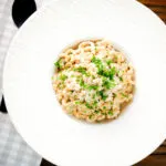 Overhead creamy Philadelphia or cream cheese pasta with garlic and chives.