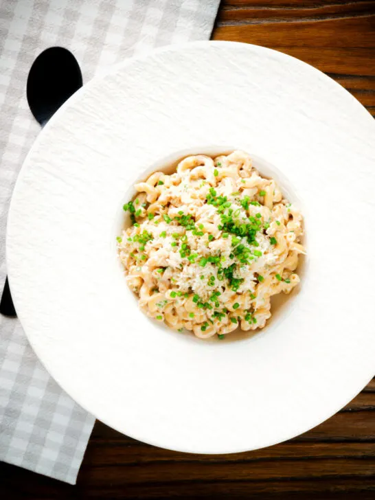 Overhead creamy Philadelphia or cream cheese pasta with garlic and chives.
