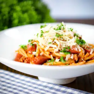 Filipino (Jollibee) sweet spaghetti with hot dog sausages and cheddar cheese.