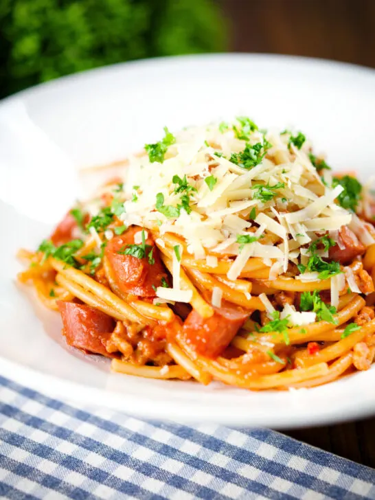 Filipino (Jollibee) spaghetti with pork, hot dog sausages and cheddar cheese.