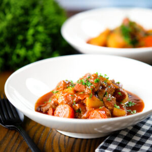 Filipino pork menudo stew with liver hotdog sausages, potatoes and carrots.