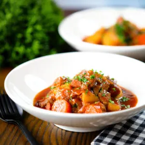 Filipino pork menudo stew with liver hotdog sausages, potatoes and carrots.