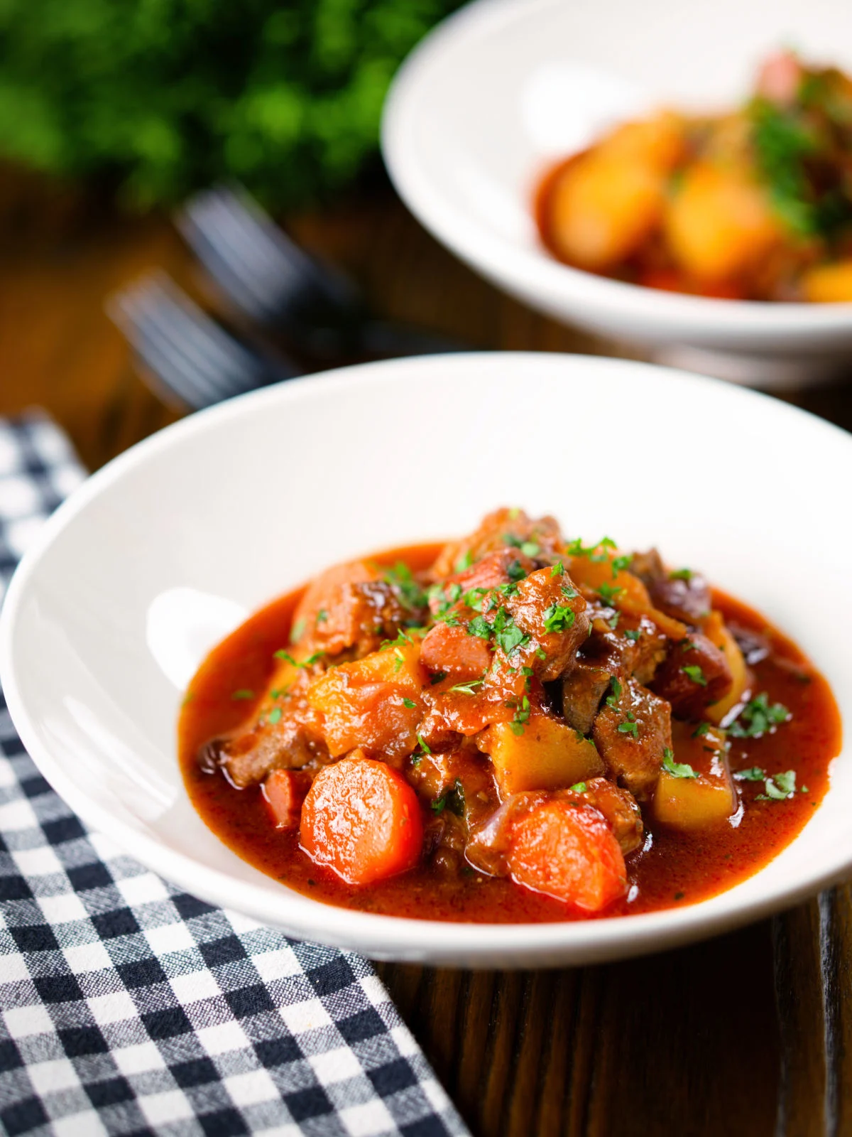 Filipino pork menudo with liver, hotdog sausages, potatoes and carrots.