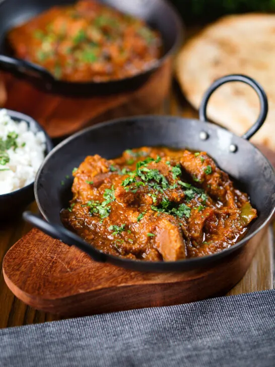 Indian (Goan) inspired pork vindaloo curry served with rice and naan bread.