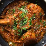 Close-up overhead Indian (Goan) inspired pork vindaloo curry.