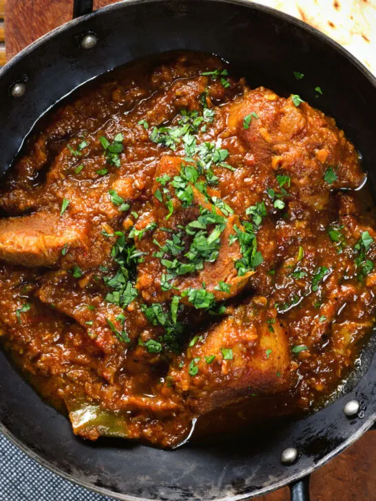 Close-up overhead Indian (Goan) inspired pork vindaloo curry.