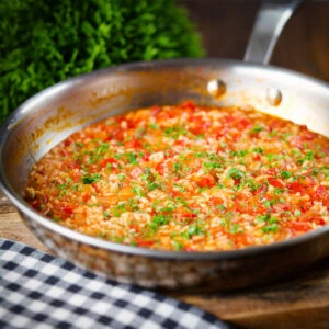 Portuguese arroz con tomate, a simple tomato rice side dish.