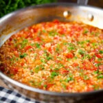 Portuguese arroz con tomate (tomato rice) side dish in its cooking pan.