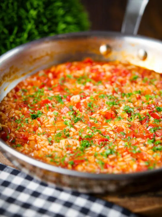 Portuguese arroz con tomate (tomato rice) side dish in its cooking pan.