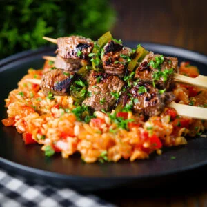Portuguese beef espetada skewers served with arroz con tomate.