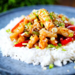 Spicy squid stir fry in oyster sauce and crispy chilli oil served with white rice.