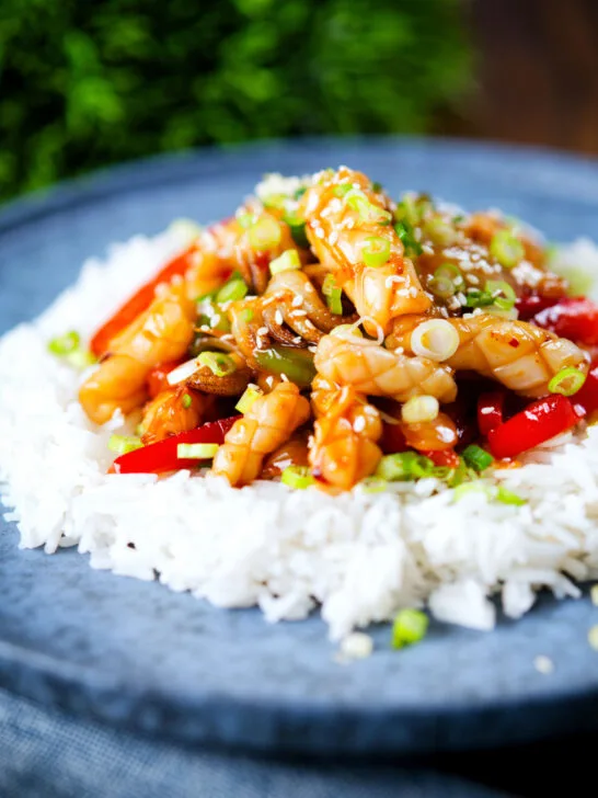 Spicy squid stir fry in oyster sauce and crispy chilli oil served with white rice.