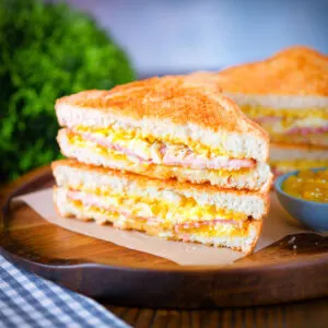 Crispy golden air fryer cooked ham and cheese toastie with British piccalilli.