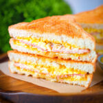 Crispy air fryer cooked ham and cheese toastie with piccalilli.