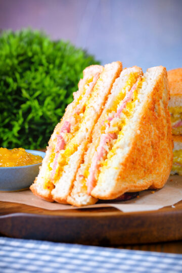 Crispy golden air fryer cooked ham and cheese toastie with piccalilli.