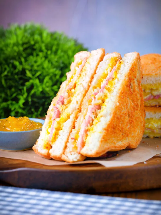 Crispy golden air fryer cooked ham and cheese toastie with piccalilli.