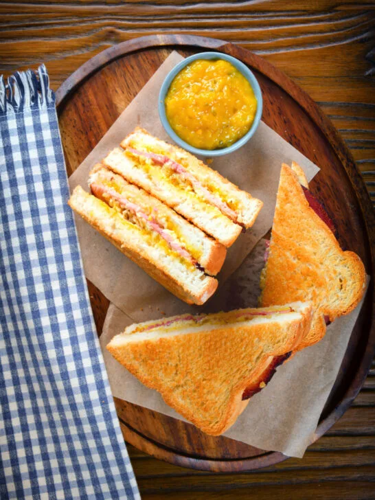 Overhead air fryer cooked ham and cheese toastie with piccalilli.