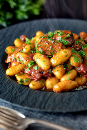 Sausage gnocchi in a rich tomato sauce served.