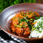 Indian beef & pork sausage curry with green beans served with plain rice.