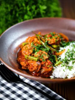 Indian beef & pork sausage curry with green beans served with plain rice.