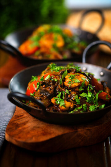 Indian-influenced chicken, mushroom and tomato curry served with naan bread.