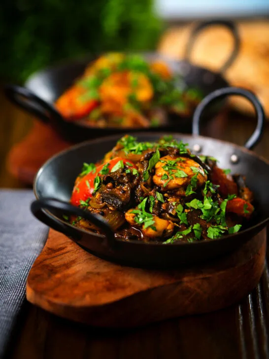 Indian-influenced chicken, mushroom and tomato curry served with naan bread.