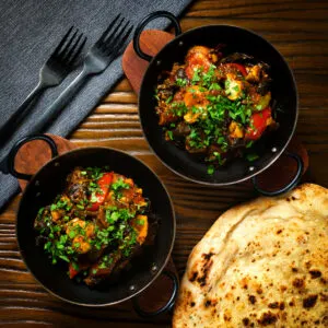 "Home style" Indian-influenced chicken mushroom and tomato curry.
