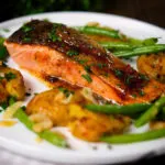 Orange and marmalade glazed salmon with new potatoes and green beans.