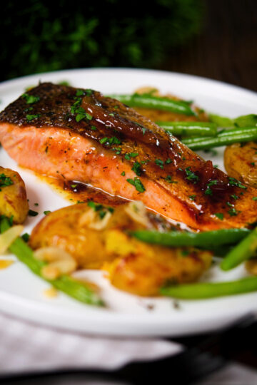 Orange and marmalade glazed salmon with new potatoes and green beans.
