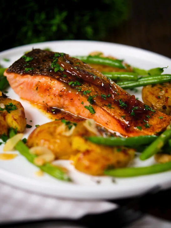 Orange and marmalade glazed salmon with new potatoes and green beans.