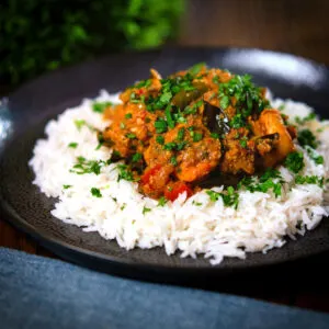 Andhra style chicken curry (kodi kura) served with Basmati rice and coriander.