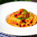 Chorizo sausage and bacon pasta in a tomato sauce.