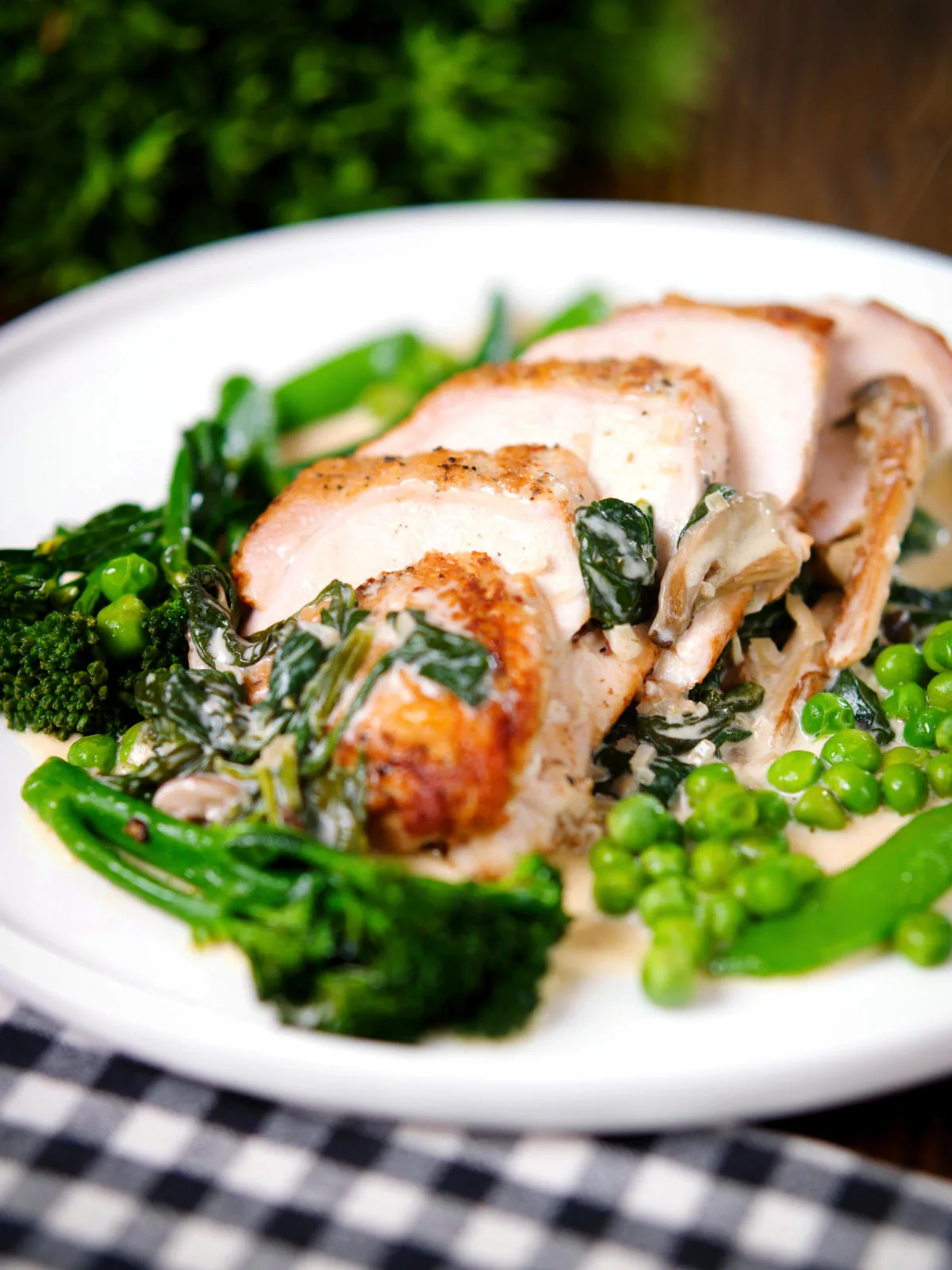 Creamy chicken and oyster mushroom Florentine served with green vegetables.