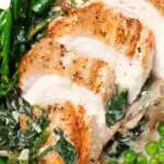 Overhead close-up creamy chicken and oyster mushroom Florentine served with green vegetables.