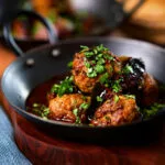 Kashmiri meatball curry, Lamb rista in a spicy saffron gravy.