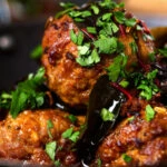 Close-up Kashmiri meatball curry, Lamb rista in a spicy saffron gravy.