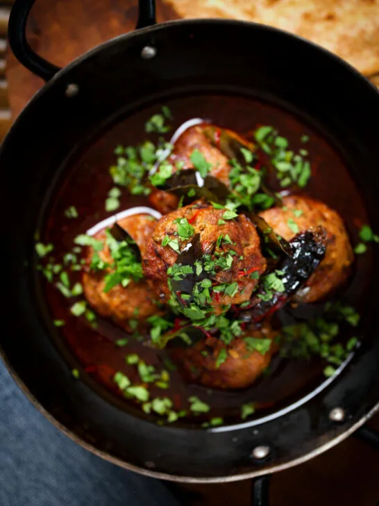 Overhead close-up Kashmiri meatball curry, Lamb rista in a spicy saffron gravy.