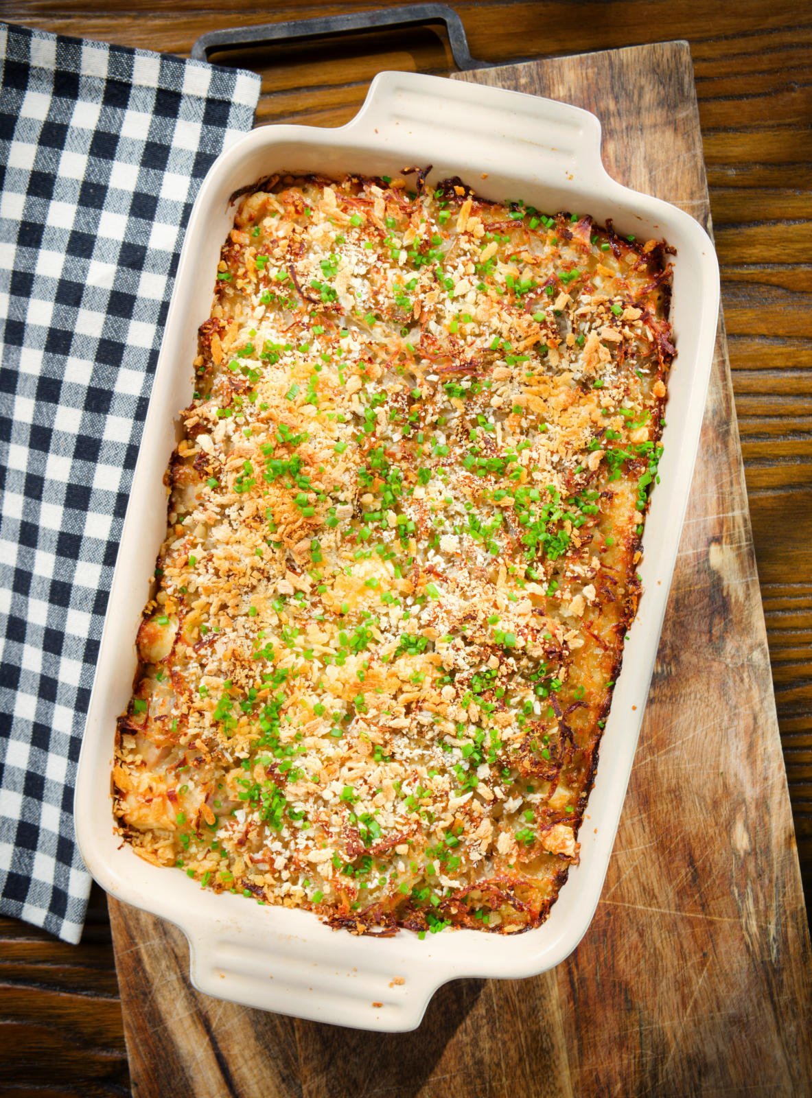 Cheesy chicken, bacon and potato gratin in a baking dish.