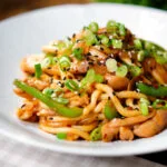 Garlic chicken udon noodles stir fry with crispy chilli oil.