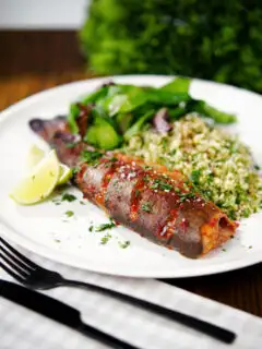 Harissa baked/roasted rainbow trout with herbed bulgur wheat.