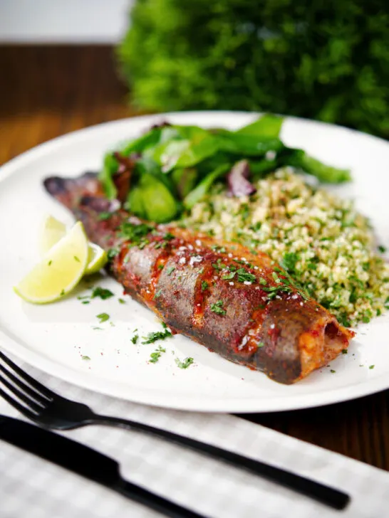 Harissa baked/roasted rainbow trout with herbed bulgur wheat.