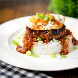 Hawaiian loco moco: beef patty, white rice, gravy and a fried egg.
