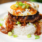 Hawaiian loco moco: beef patty, white rice, Worcestershire sauce gravy and a fried egg.